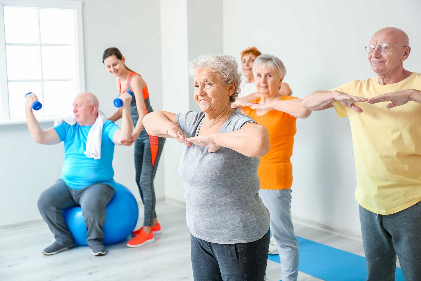 Image of smiling seniors exercising